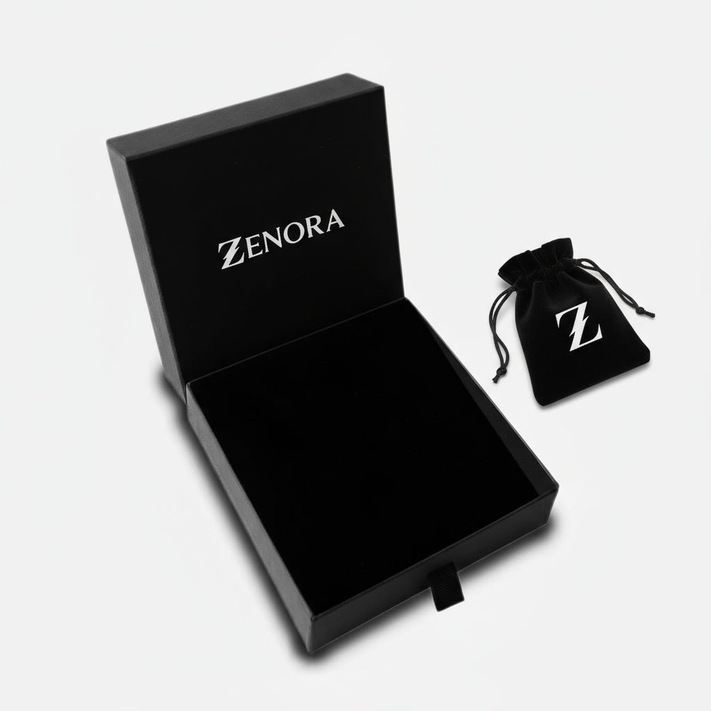 Black Zenora jewelry box and drawstring bag on a light gray background