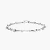 Silver bracelet with small diamonds on a white background