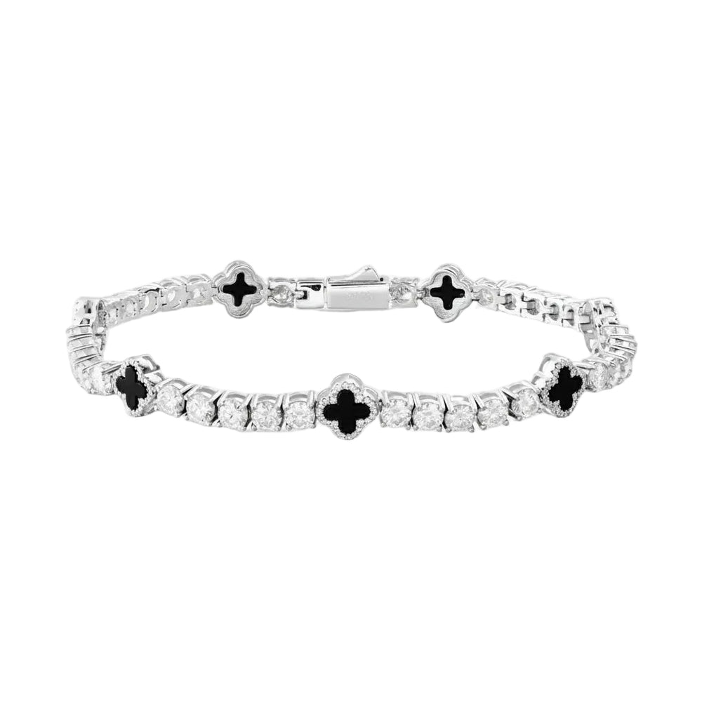 Silver bracelet with black and clear stones on a white background