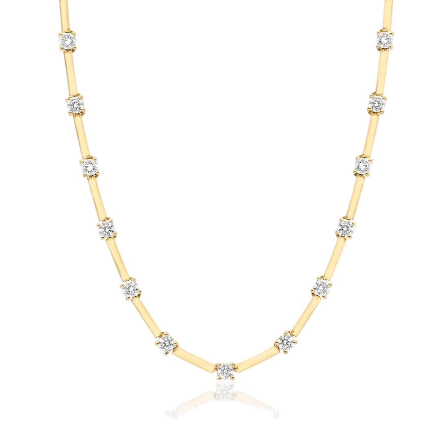 Gold necklace with diamond beads on a white background