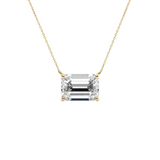 An emerald-cut diamond pendant necklace in a yellow gold setting on a delicate gold chain, shown against a plain white background.