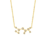 Gold necklace with a star-shaped pendant on a white background