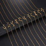 Gold necklaces with zodiac constellation pendants on a black background