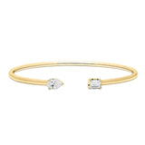 Gold bracelet with two diamond pendants on a white background