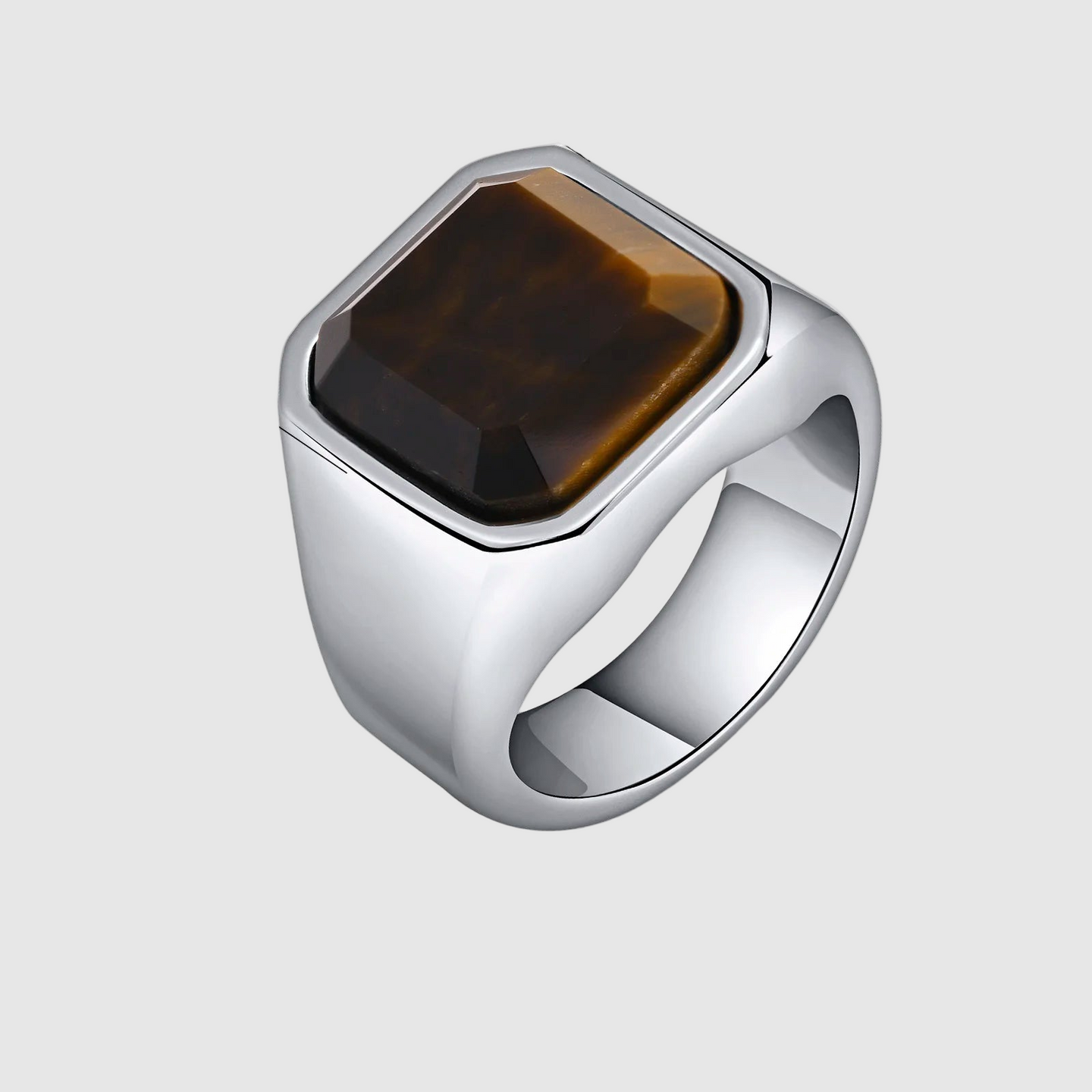Silver ring with a brown stone and measurements on a white background
