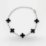 Bracelet with black flower-shaped charms on a white background