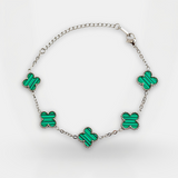 Necklace with green butterfly-shaped pendants on a white background