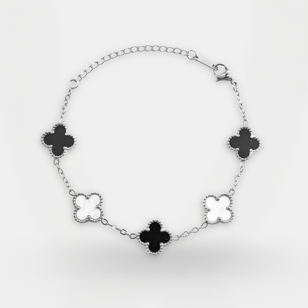 Bracelet with black clover-shaped charms on a white background