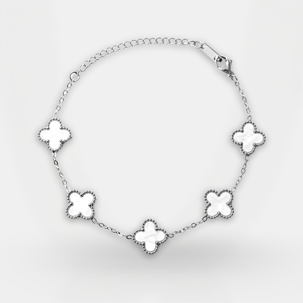 Silver bracelet with clover-shaped charms on a white background