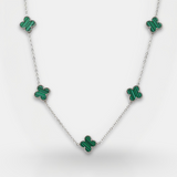 Necklace with green emerald-like stones on a white background