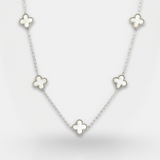 Necklace with four-leaf clover pendants on a light gray background