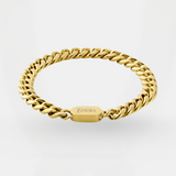 Gold chain bracelet with 'Zenora' tag on a light gray background