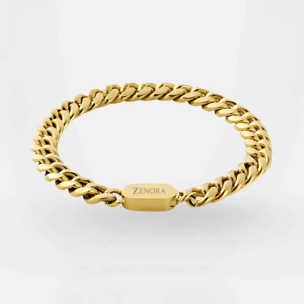 Gold chain bracelet with 'Zenora' tag on a light gray background