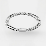 Silver chain bracelet with 'Zenora' branding on a light gray background
