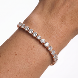 Rose gold 5mm moissanite tennis bracelet on wrist