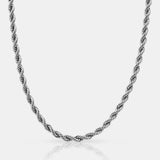 Silver rope chain necklace on a light gray background
