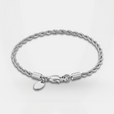 Silver bracelet with a clasp and tag on a light gray background