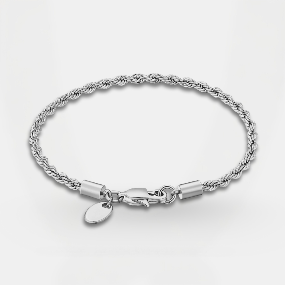 Silver bracelet with a clasp and tag on a light gray background