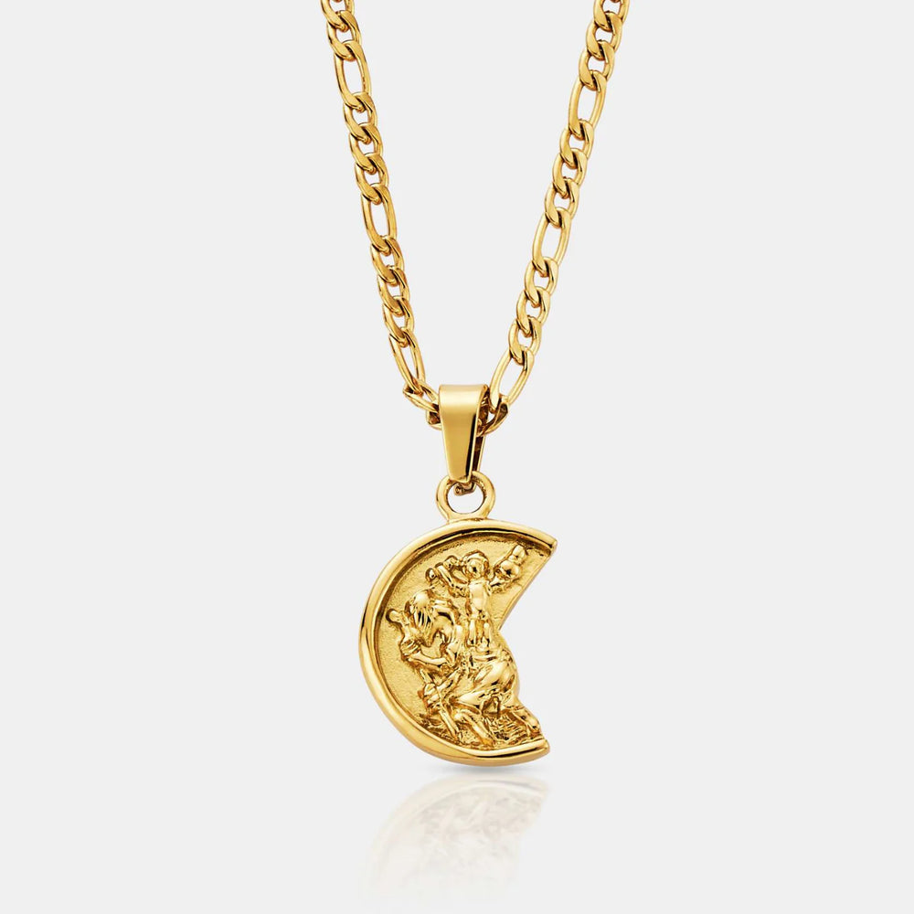 Gold necklace with a crescent moon pendant on a light gray background