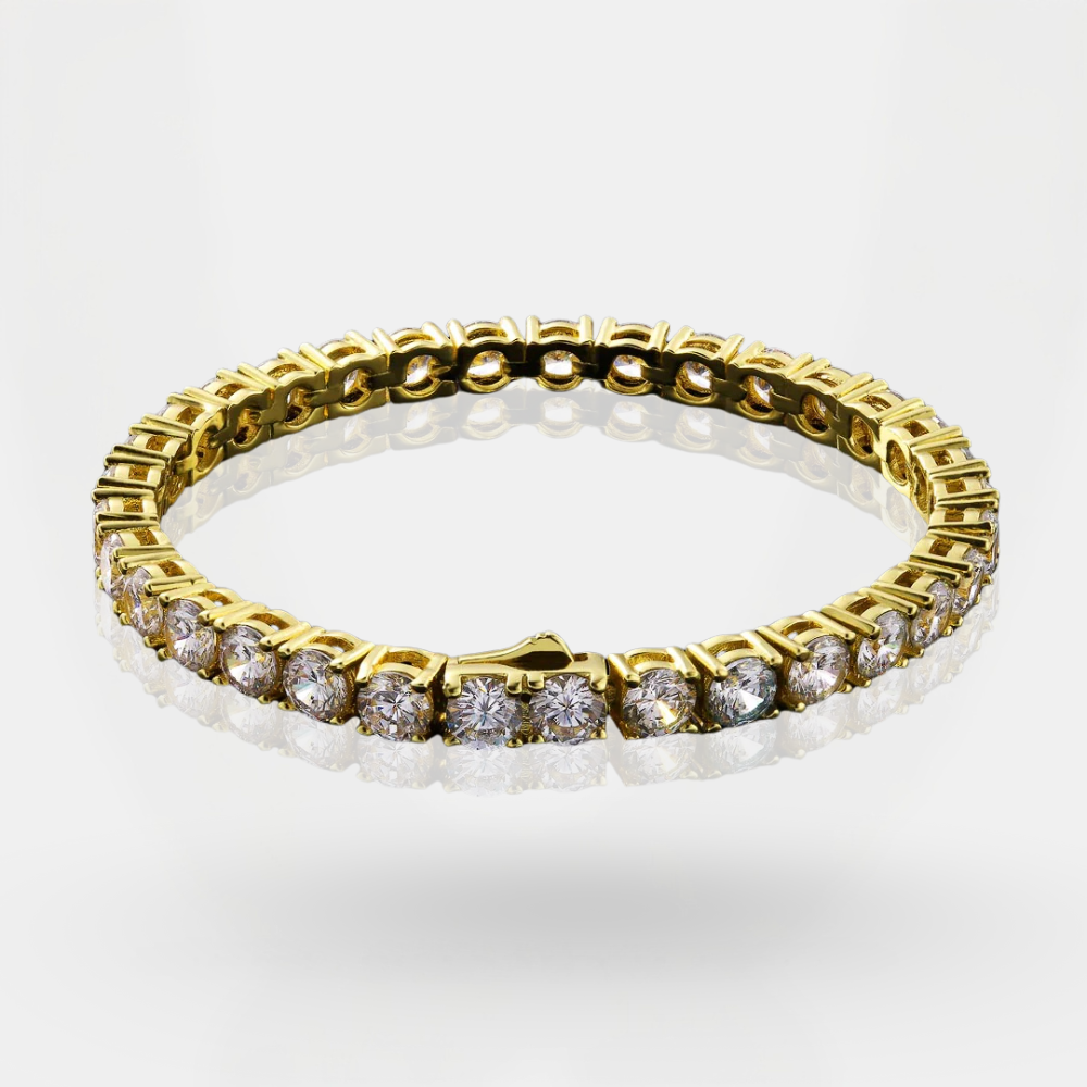 Gold bracelet with clear stones on a white background