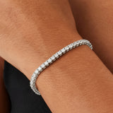 Silver bracelet on a wrist with a blurred background
