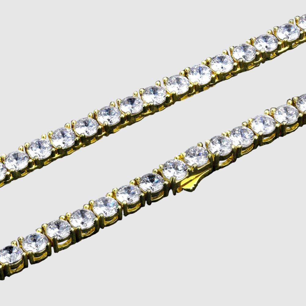 Gold chain with clear crystals on a black background