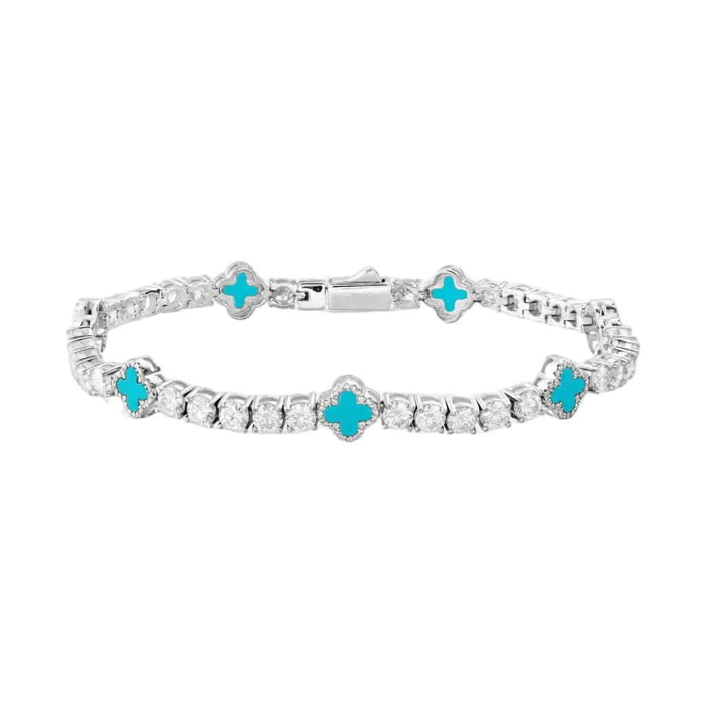 Silver bracelet with turquoise clover-shaped stones on a white background