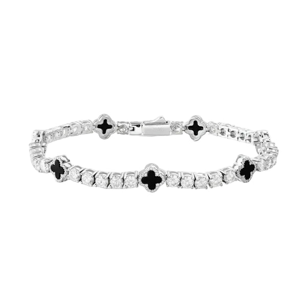 Silver bracelet with black and clear stones on a white background
