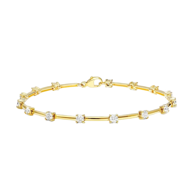 Gold bracelet with small diamonds on a white background