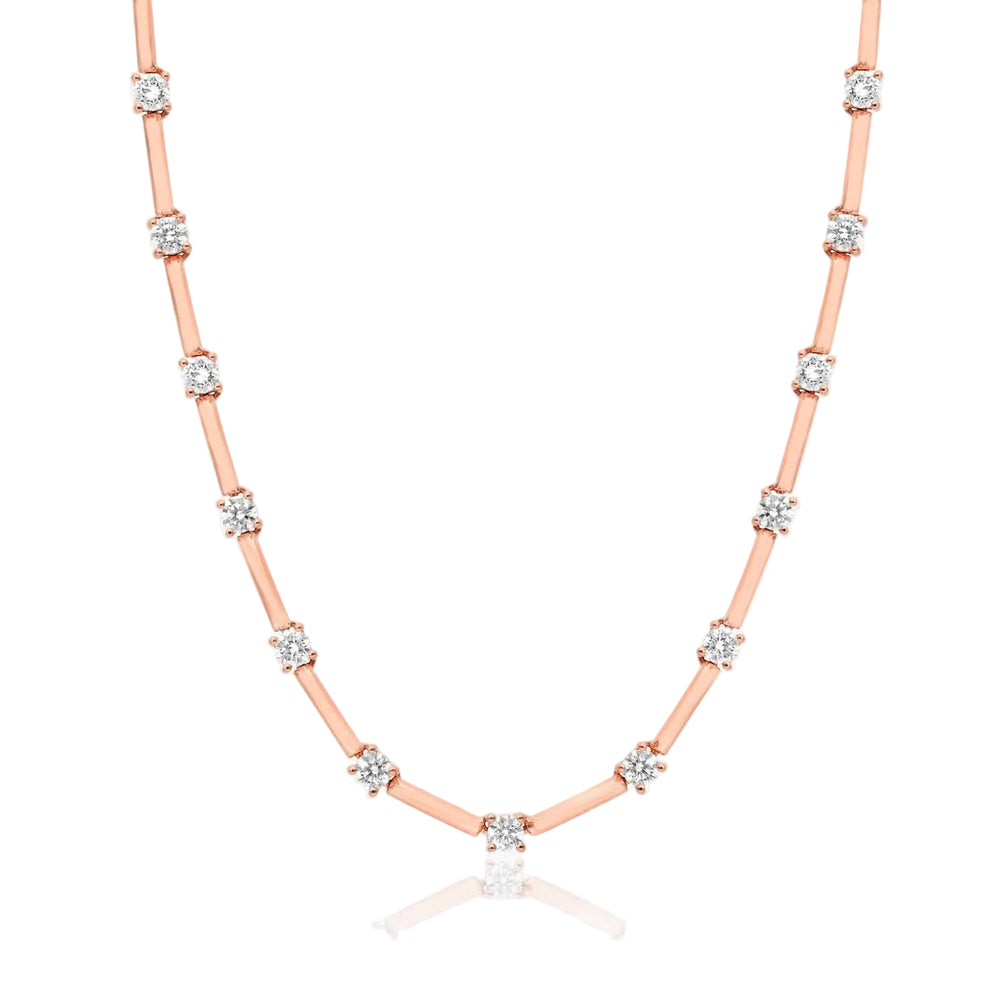 Rose gold necklace with diamonds on a white background