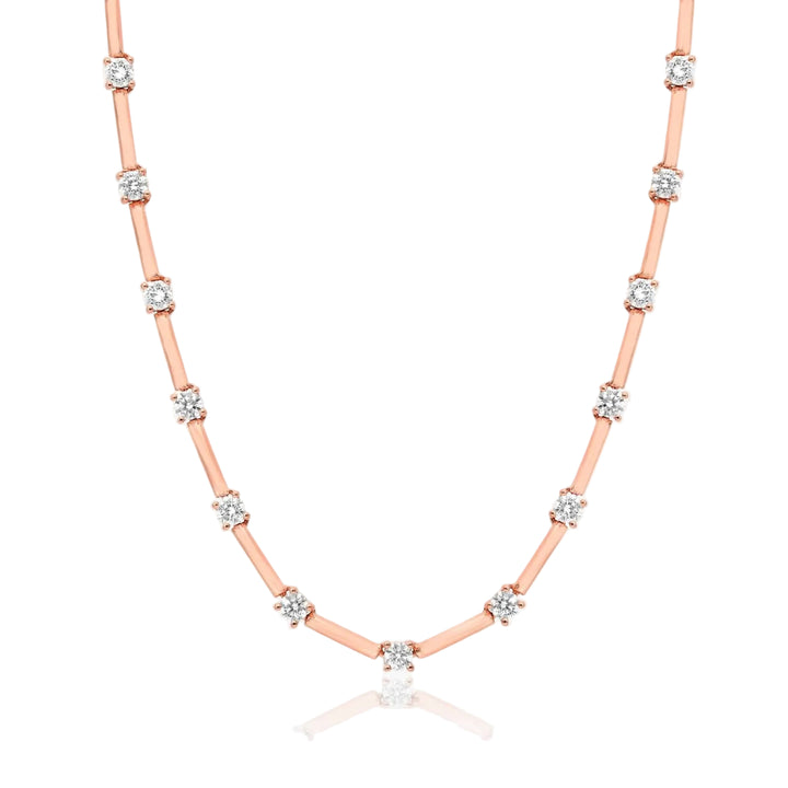 Rose gold necklace with diamonds on a white background