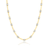 Gold necklace with diamond beads on a white background