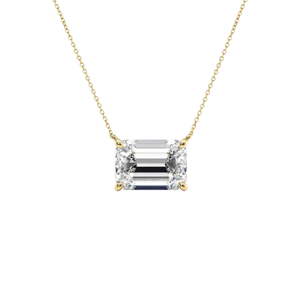 An emerald-cut diamond pendant necklace in a yellow gold setting on a delicate gold chain, shown against a plain white background.