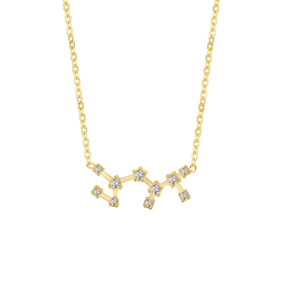 Gold necklace with a star-shaped pendant on a white background