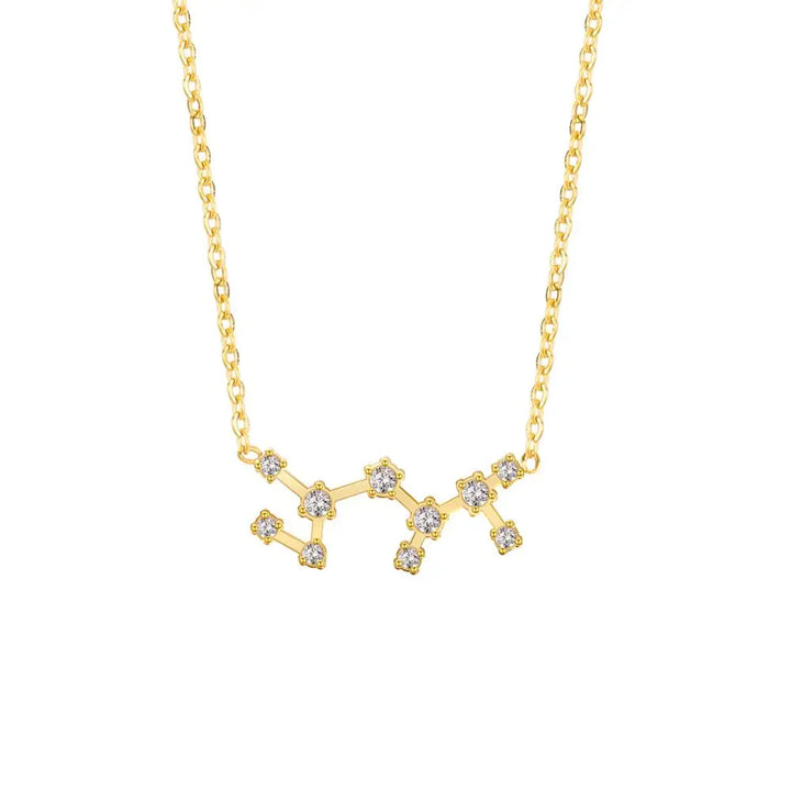 Gold necklace with a star-shaped pendant on a white background