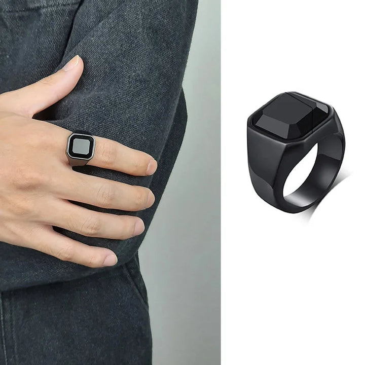black ring on finger and on white background