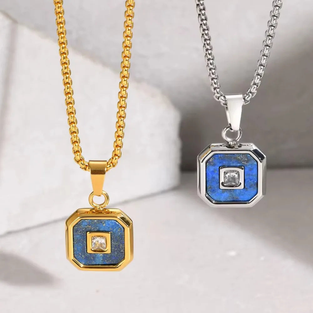 Two necklaces with blue and gold pendants on a white background