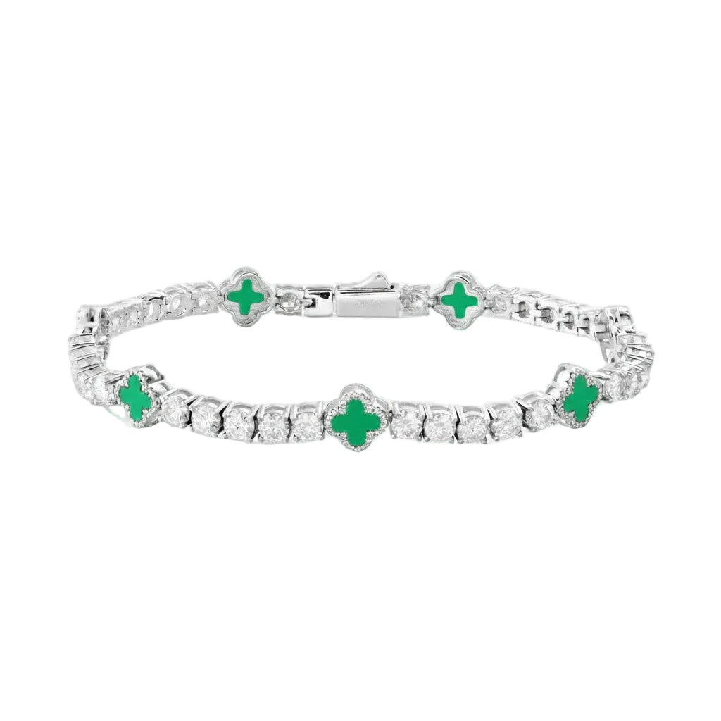 Silver bracelet with green gemstones on a white background