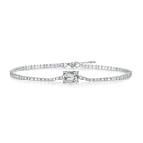 Diamond bracelet with a central emerald-cut diamond on a white background