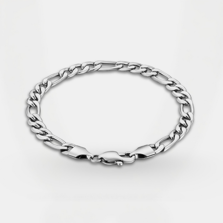 Silver chain bracelet on a light gray background