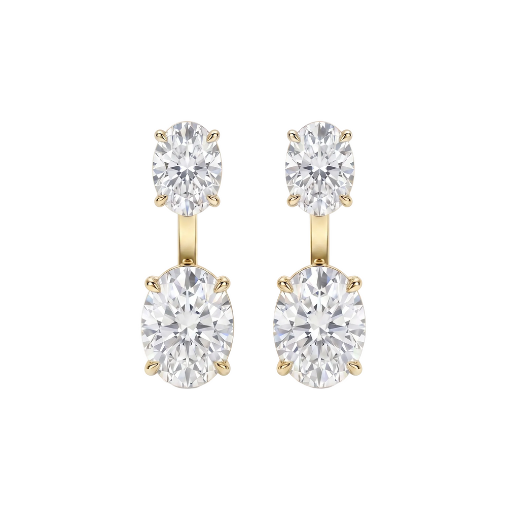 Pair of diamond earrings with gold settings on a white background