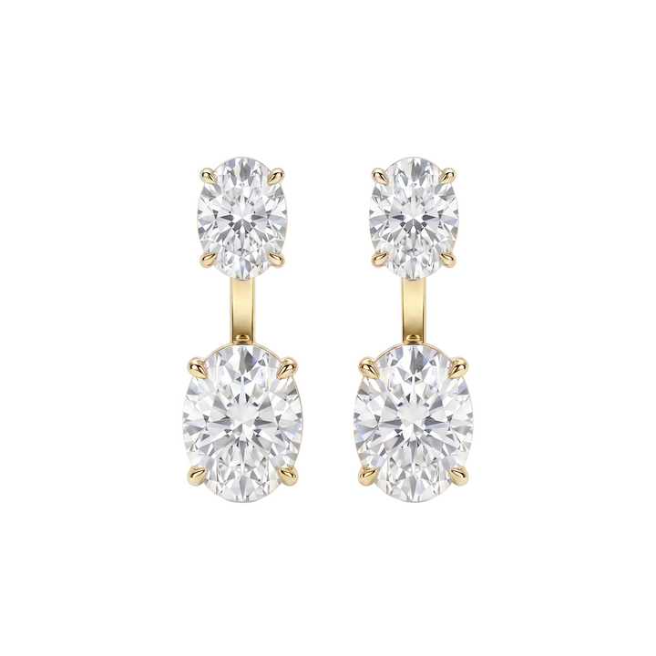 Pair of diamond earrings with gold settings on a white background