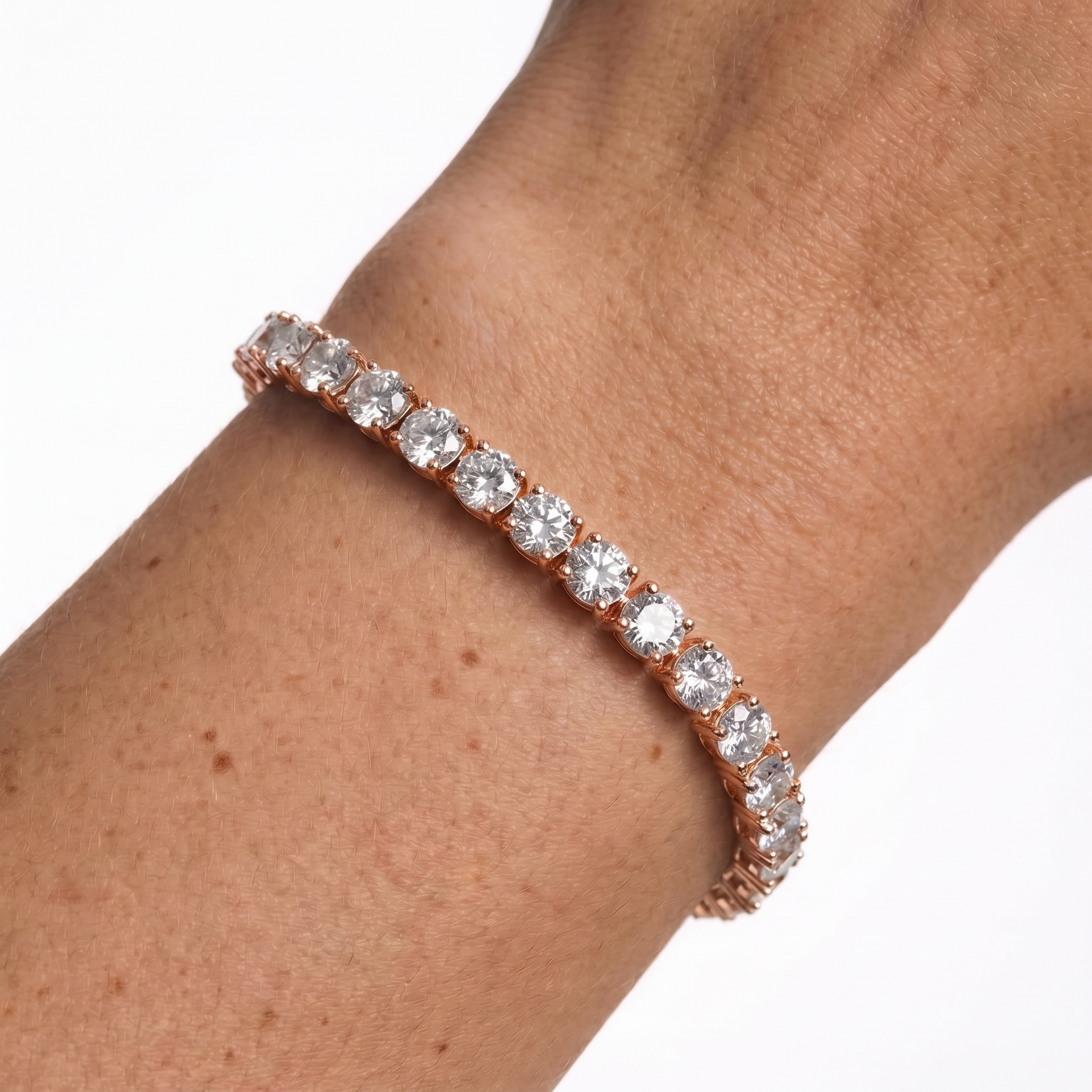 Rose gold 5mm moissanite tennis bracelet on wrist