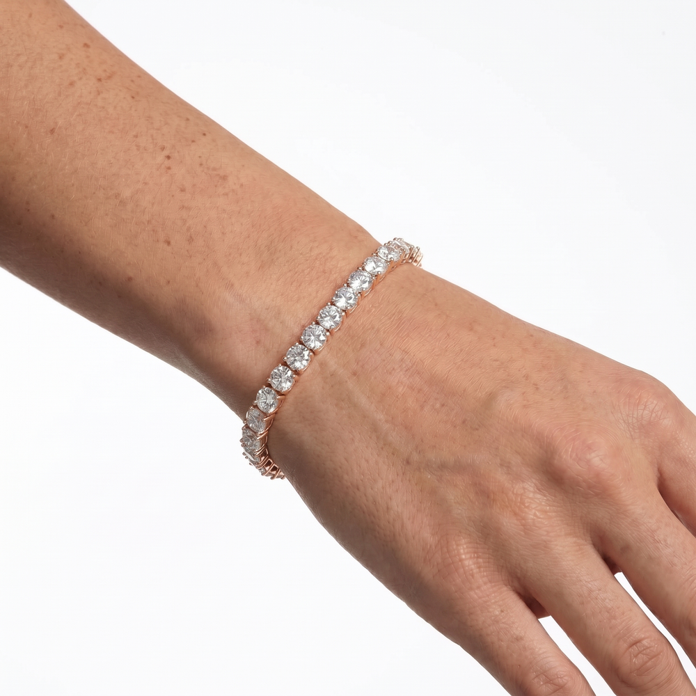 Rose gold 5mm moissanite tennis bracelet styled on hand