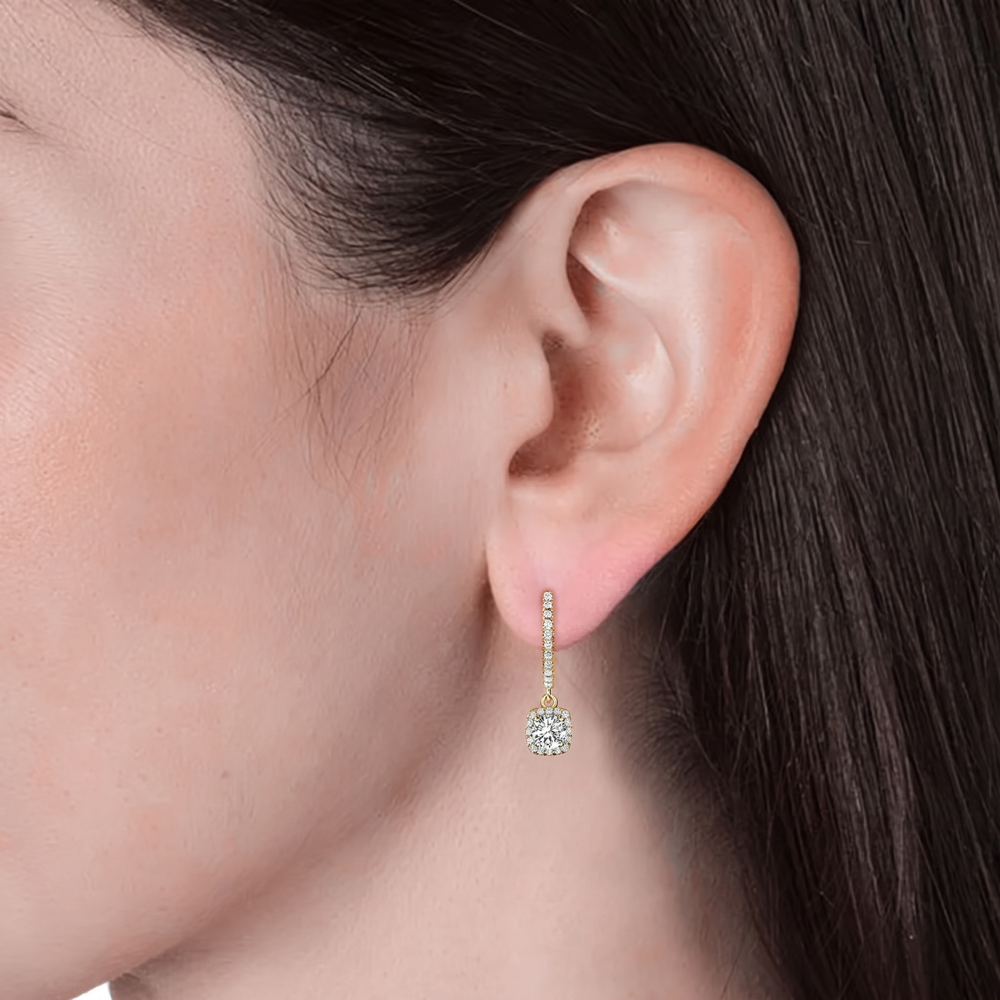 Mira gold moissanite drop earring on ear