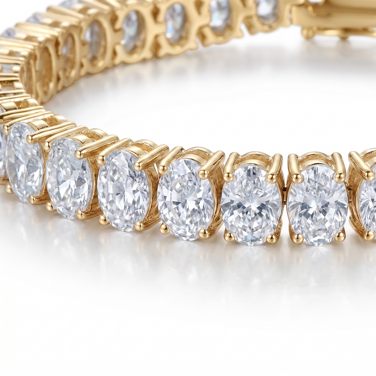 Oval cut moissanite tennis bracelet gold close-up