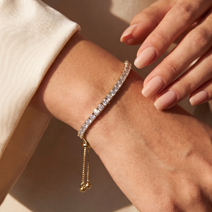 Adjustable bolo tennis bracelet gold styled on wrist
