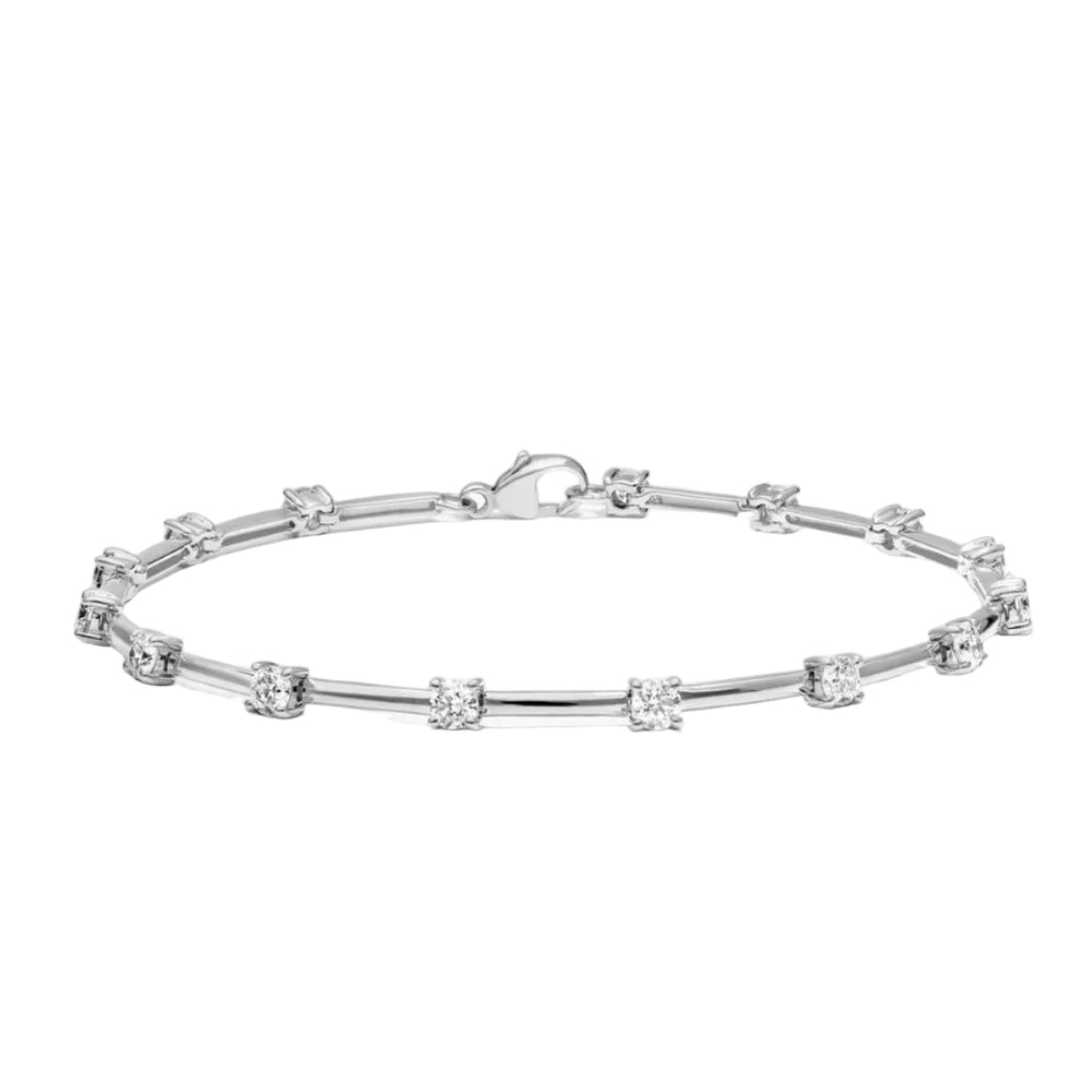 Silver bracelet with small diamonds on a white background