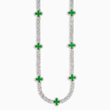 Necklace with green gemstones on a white background